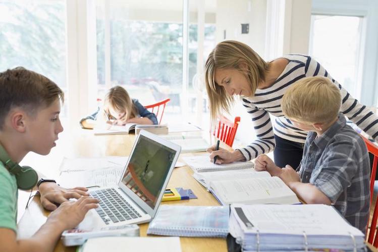 homeschool mom helping kids