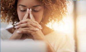 exam stress lady with fingers on nose