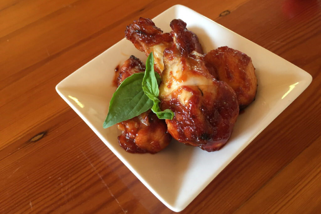Sticky Chicken Wings on a square plate